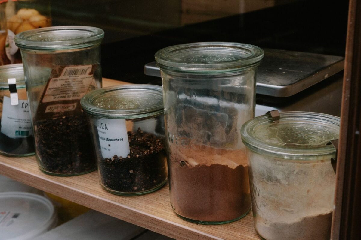 things to declutter small home fast – spice jars lined up on a kitchen shelf