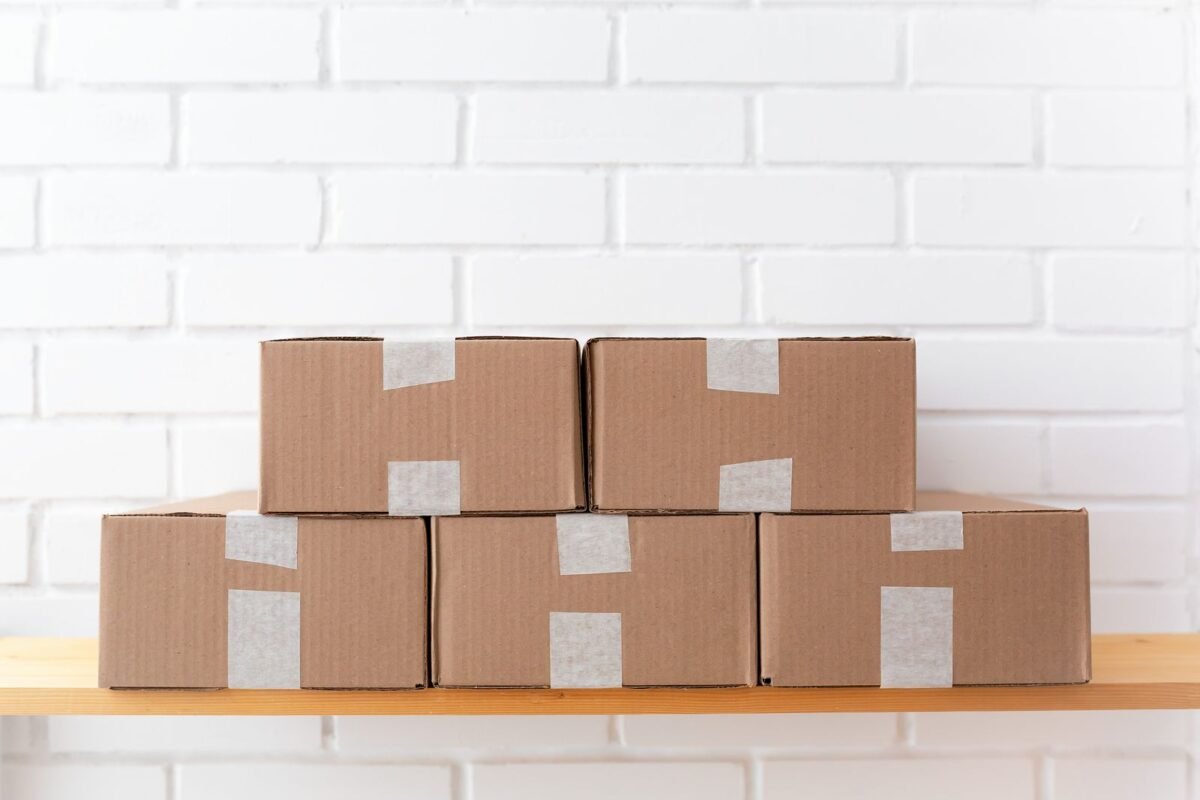 things to declutter small home fast – stack of empty cardboard boxes on a shelf