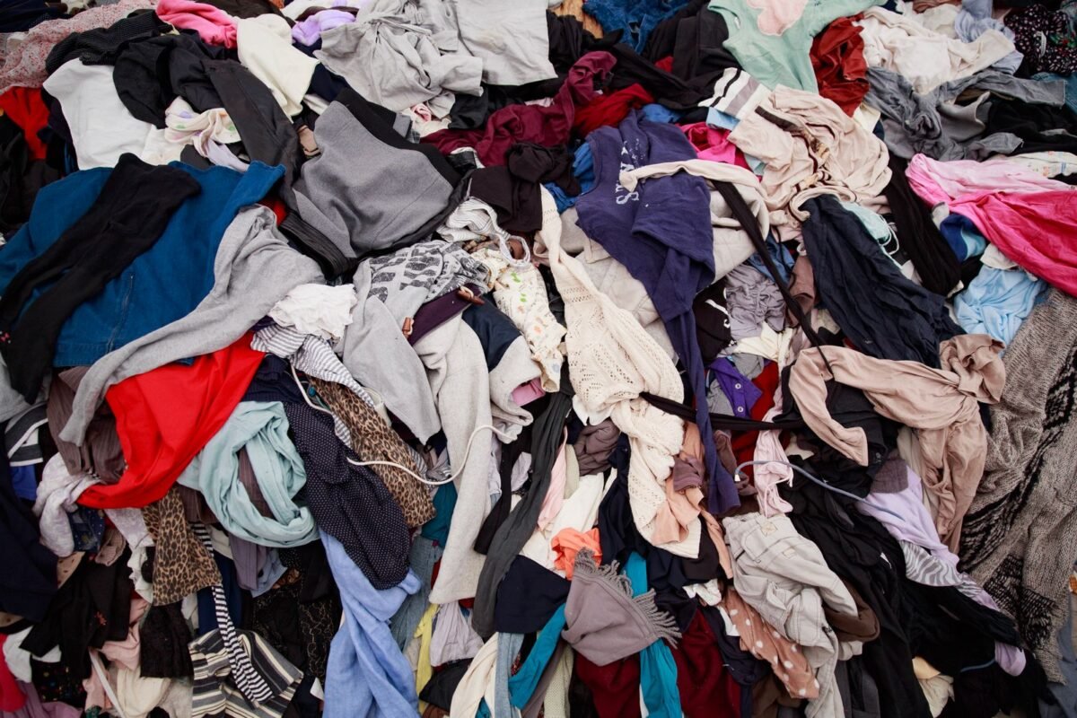 things to declutter small home fast – large pile of clothes pulled out for sorting