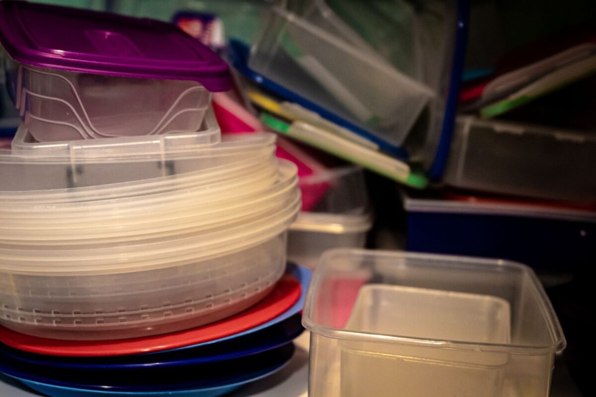 things to declutter small home fast – stack of plastic food containers with lids