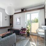 Bright, tidy small apartment living room with clutter hidden away - small living room storage ideas