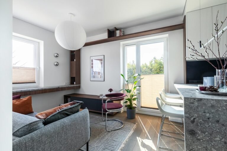 Bright, tidy small apartment living room with clutter hidden away - small living room storage ideas