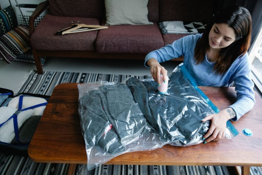 Small bedroom storage ideas no closet: sealing off-season clothes in vacuum storage bags
