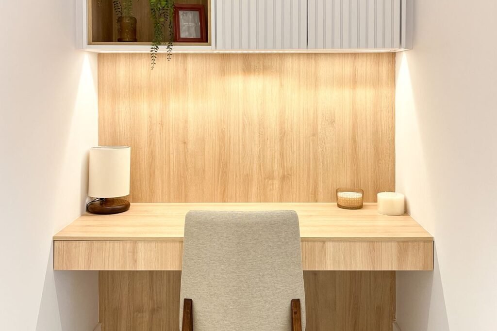 Wall-mounted desk claimed as a work nook in a studio apartment layout, using no floor space